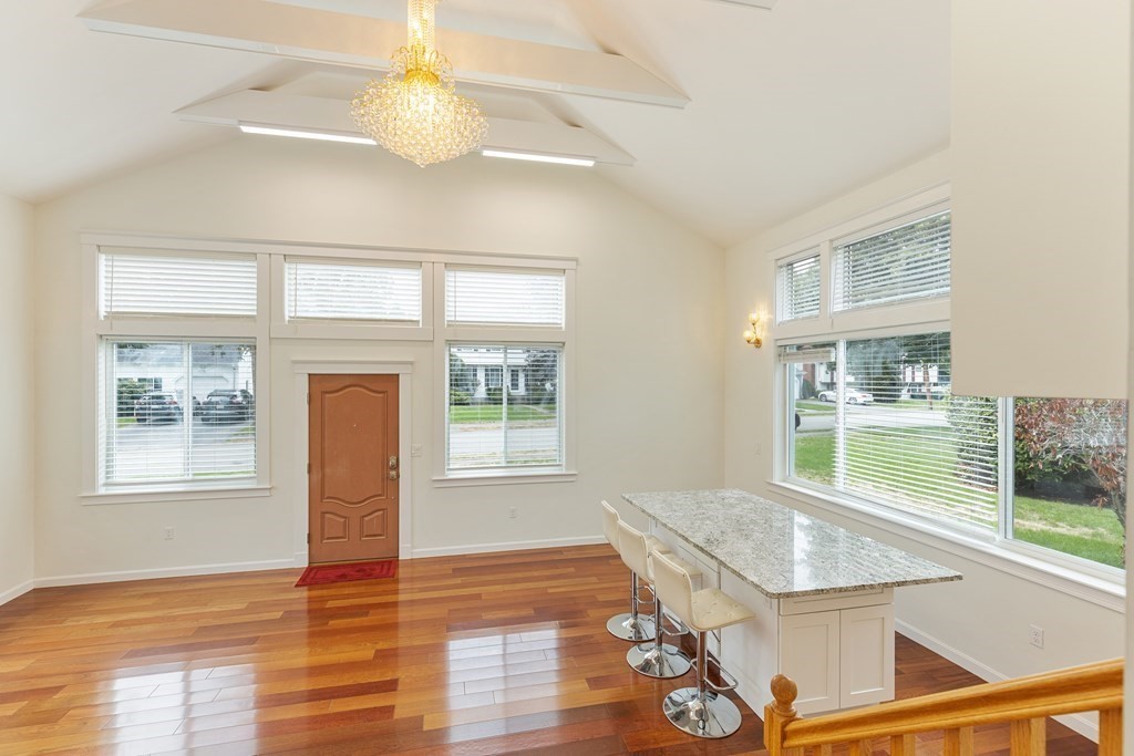 28 Standish Road Needham, MA 02492 - Photo 2 of 29 a view of an empty room with a window and wooden floor