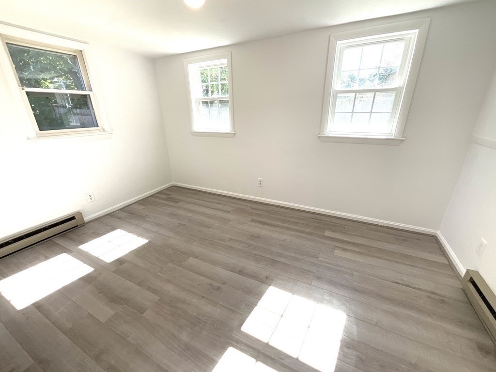 28 Standish Road Needham, MA 02492 - Photo 21 of 29 a view of an empty room and wooden floor