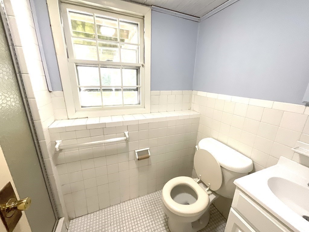 28 Standish Road Needham, MA 02492 - Photo 22 of 29 a bathroom with a toilet and a sink