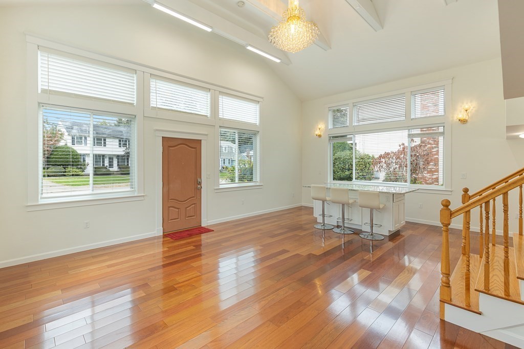 28 Standish Road Needham, MA 02492 - Photo 3 of 29 a view of an empty room with wooden floor and a window