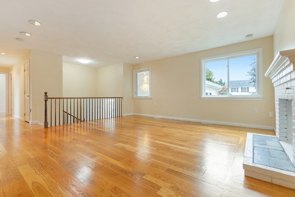 28 Standish Road Needham, MA 02492 - Photo 4 of 29 a view of an empty room with wooden floor and a window