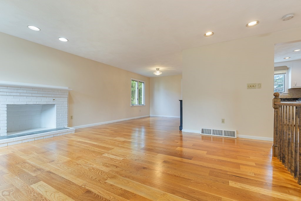 28 Standish Road Needham, MA 02492 - Photo 5 of 29 a view of an empty room with wooden floor and a window