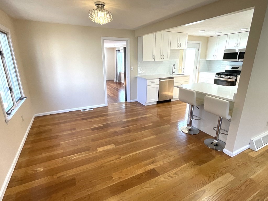 28 Standish Road Needham, MA 02492 - Photo 6 of 29 a view of kitchen with cabinets and wooden floor