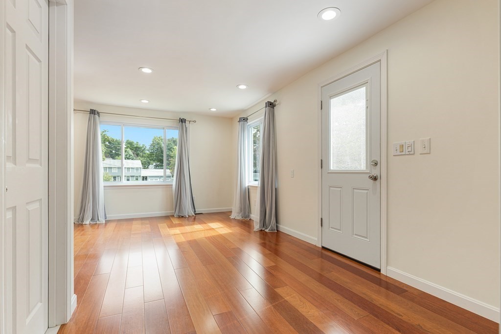 28 Standish Road Needham, MA 02492 - Photo 10 of 29 a view of an empty room with wooden floor and a window