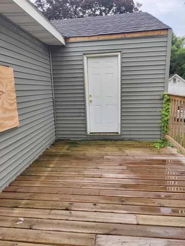 a view of a room with wooden walls