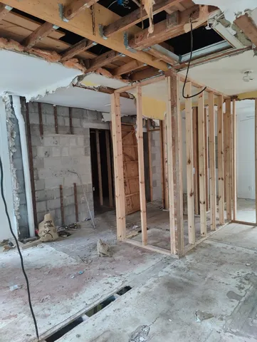 a bathroom with a glass shower door and a sink