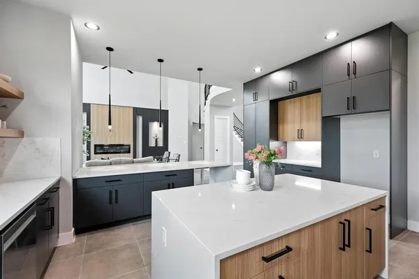 a kitchen with stainless steel appliances a sink stove and refrigerator