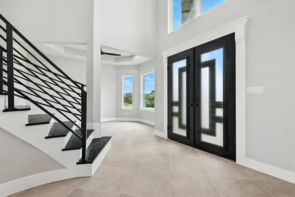 a view of an entryway with wooden floor