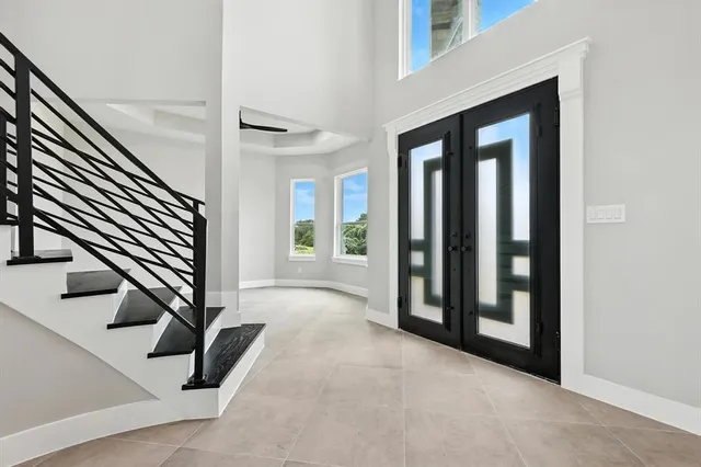 a view of an entryway with wooden floor