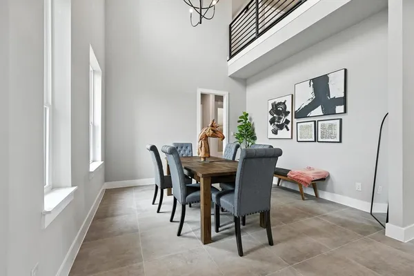 a view of a dining room with furniture and window