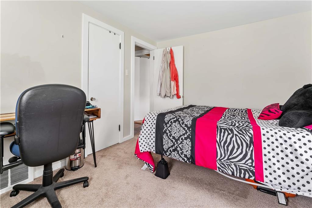 210 Hopwood Fairchance Road Uniontown, PA 15401 - Photo 15 of 28 a bedroom with a bed and a chair