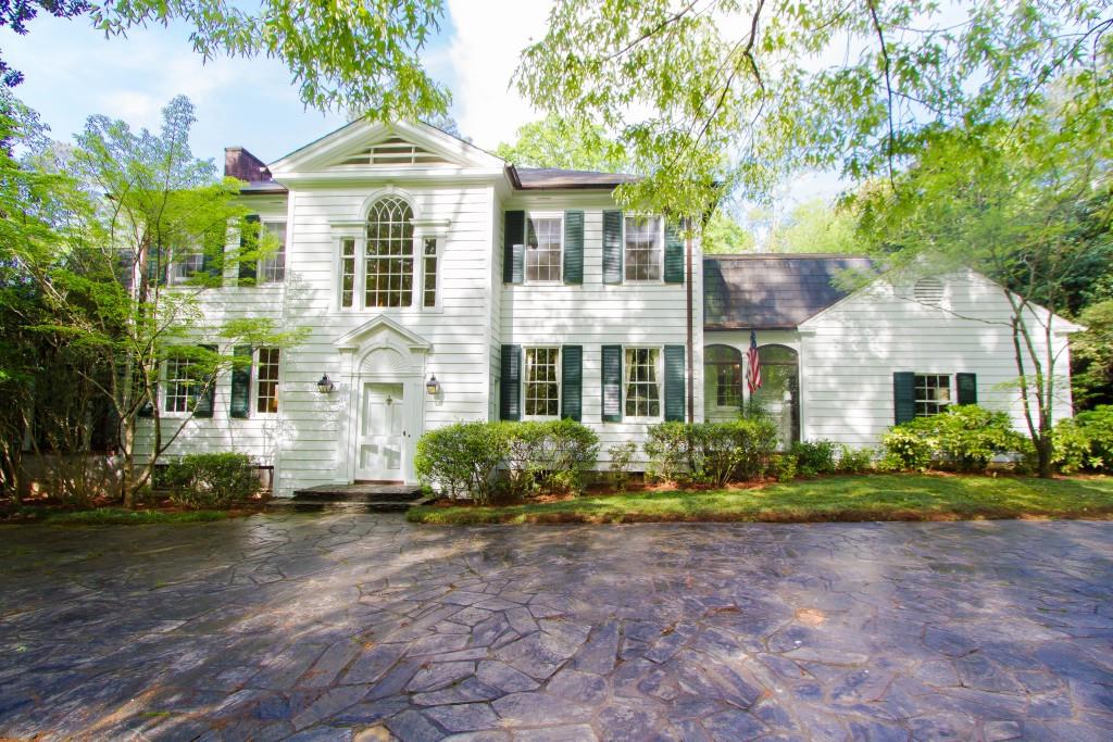 2930 Howell Mill Road Northwest Atlanta, GA 30327 - Photo 1 of 1 The front of this charming home, highlighting the palladium window and the slate area for guest parking.