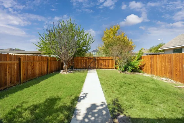 a view of backyard with green space