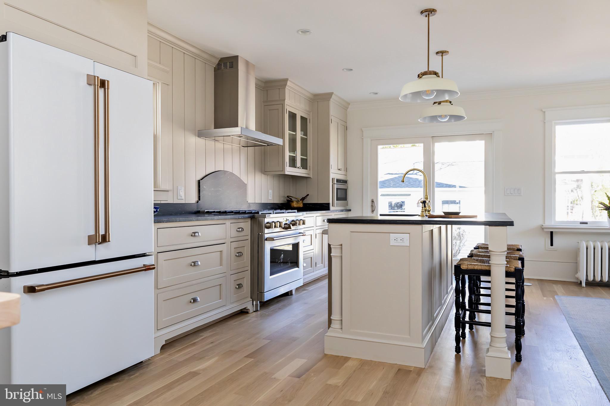 131 Marne Avenue Haddonfield, NJ 08033 - Photo 17 of 33 a kitchen with a stove a sink and a refrigerator