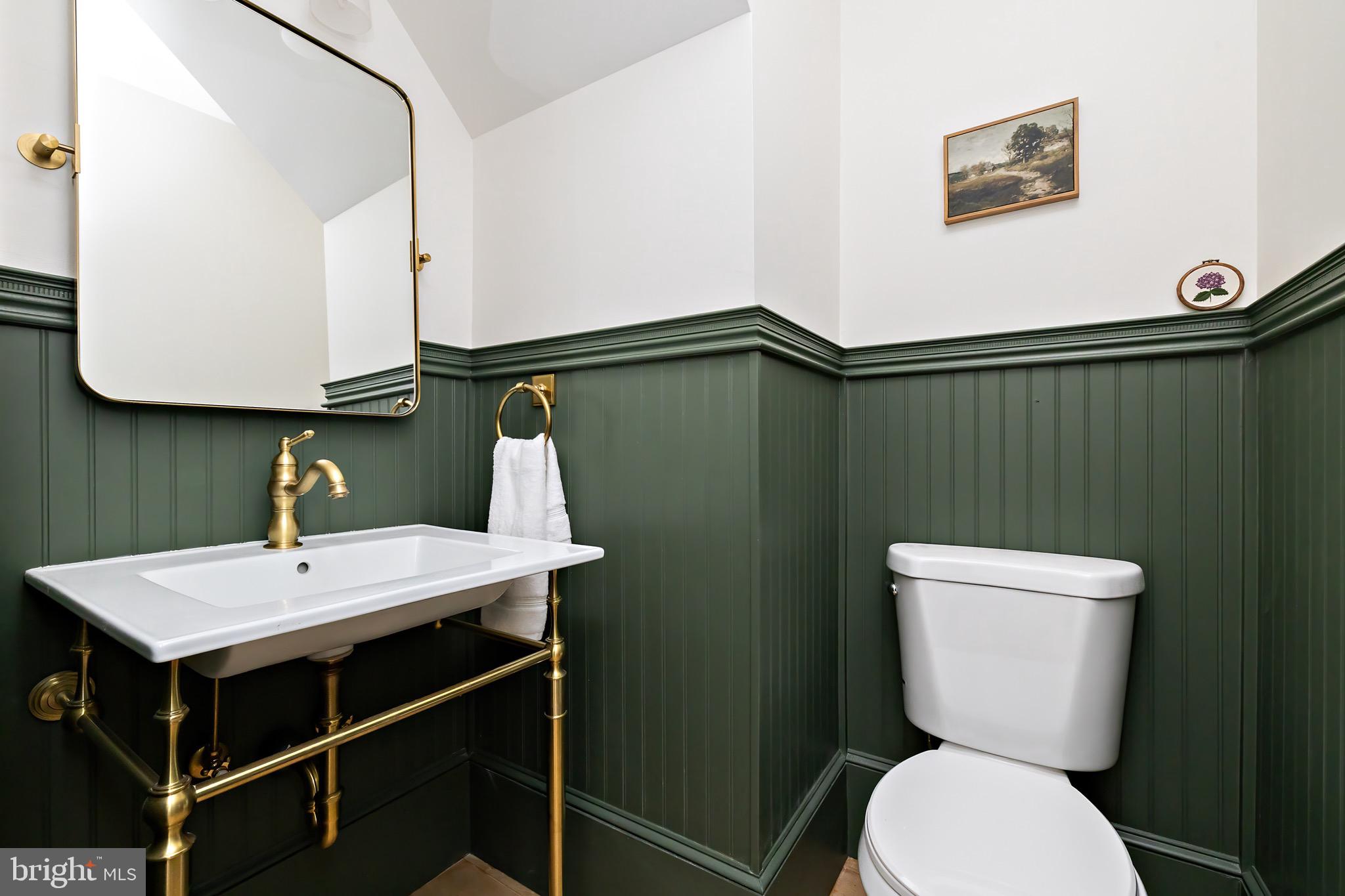 131 Marne Avenue Haddonfield, NJ 08033 - Photo 18 of 33 a bathroom with a toilet a sink and mirror