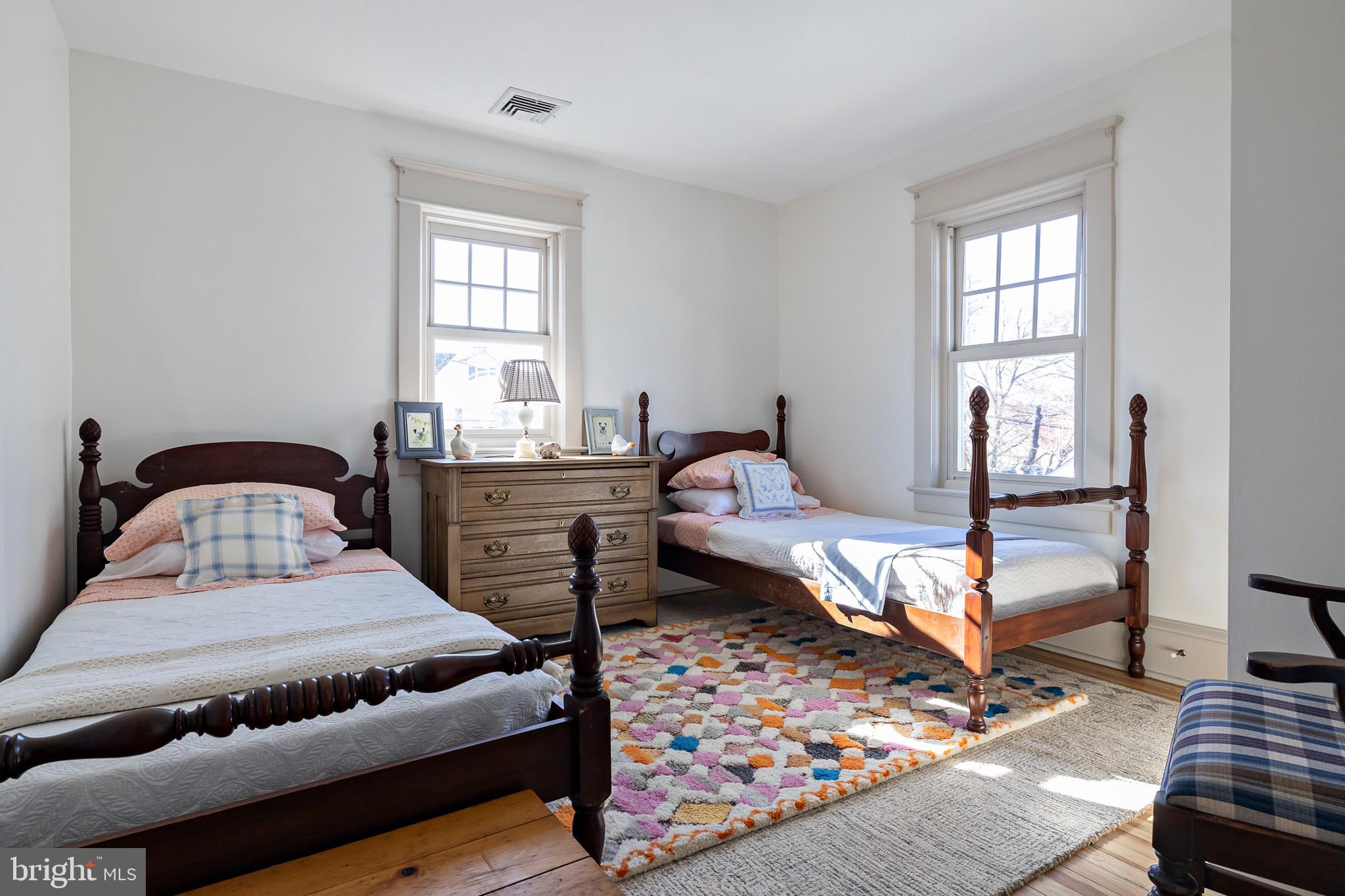 131 Marne Avenue Haddonfield, NJ 08033 - Photo 24 of 33 a bedroom with a bed and wooden floor