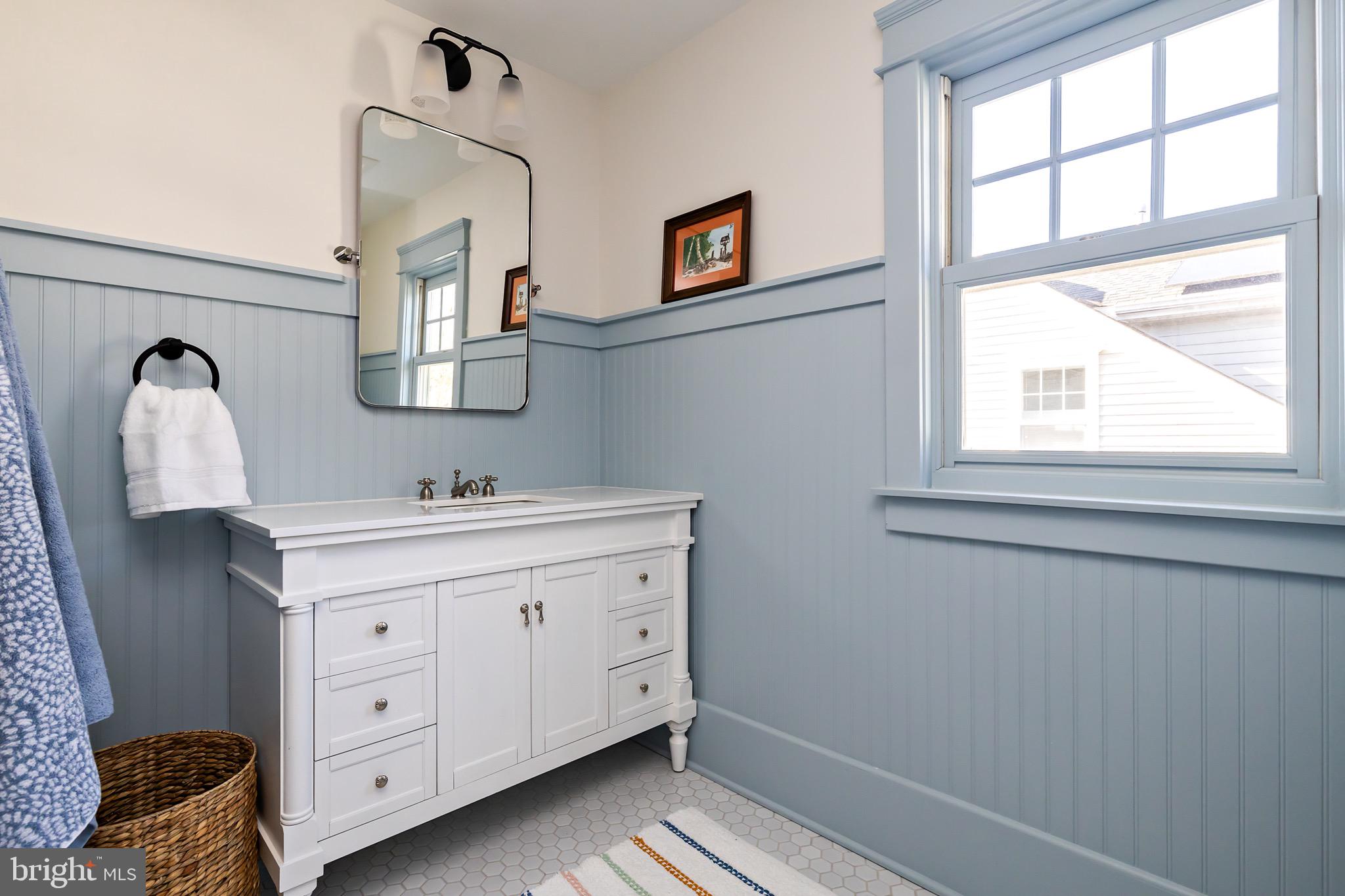 131 Marne Avenue Haddonfield, NJ 08033 - Photo 27 of 33 a spacious bathroom with a double vanity sink a mirror a window and a window