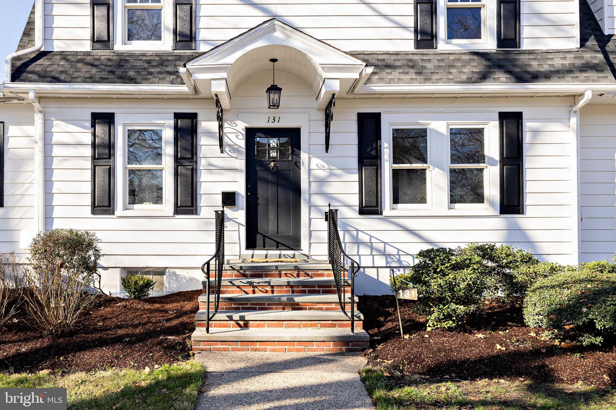 131 Marne Avenue Haddonfield, NJ 08033 - Photo 3 of 33 a front view of a house with a yard