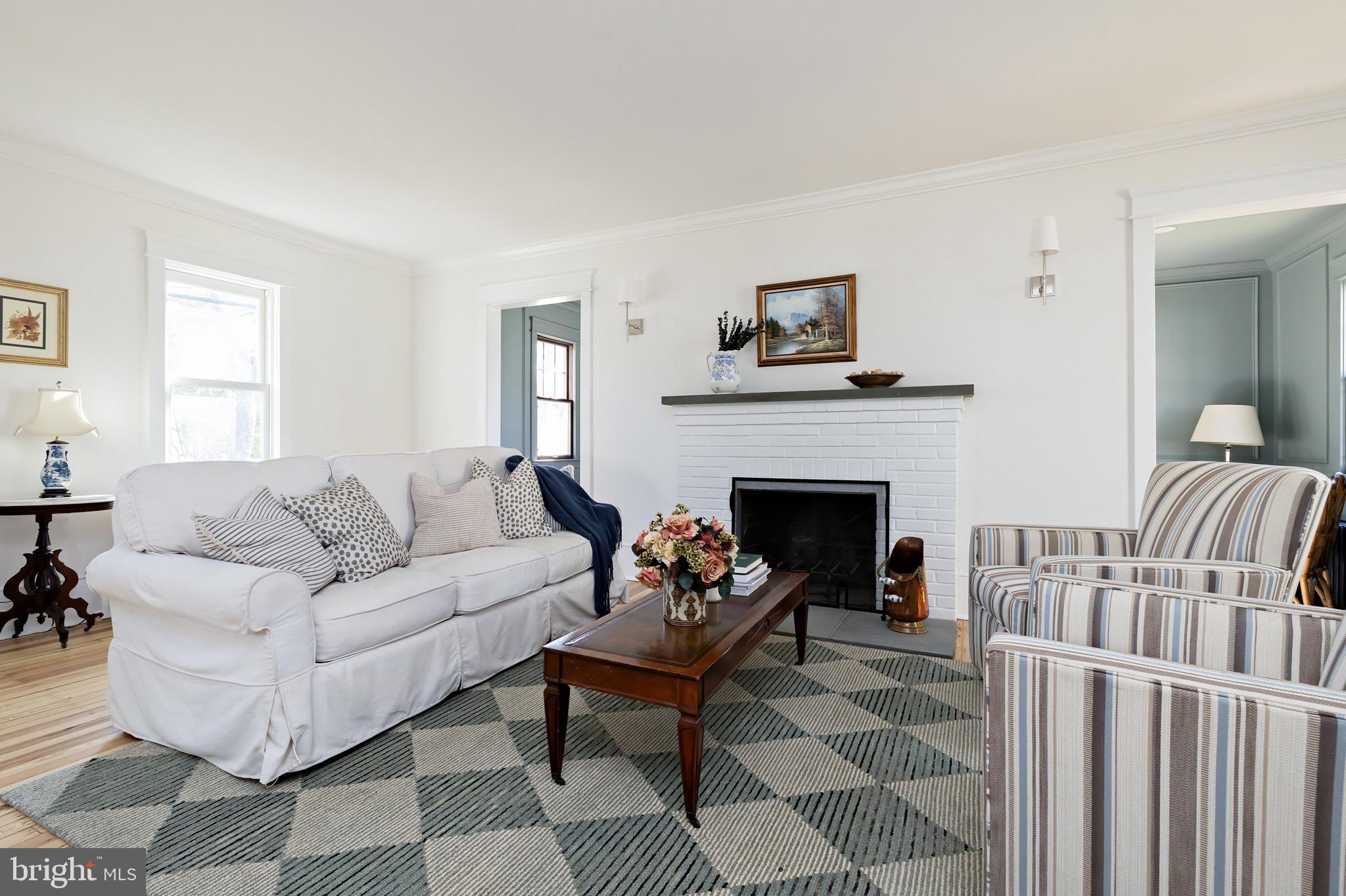 131 Marne Avenue Haddonfield, NJ 08033 - Photo 5 of 33 a living room with furniture a rug and a fireplace