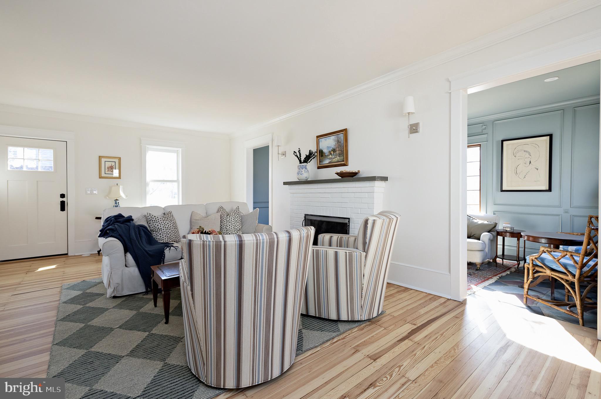 131 Marne Avenue Haddonfield, NJ 08033 - Photo 6 of 33 a living room with furniture a fireplace and a table