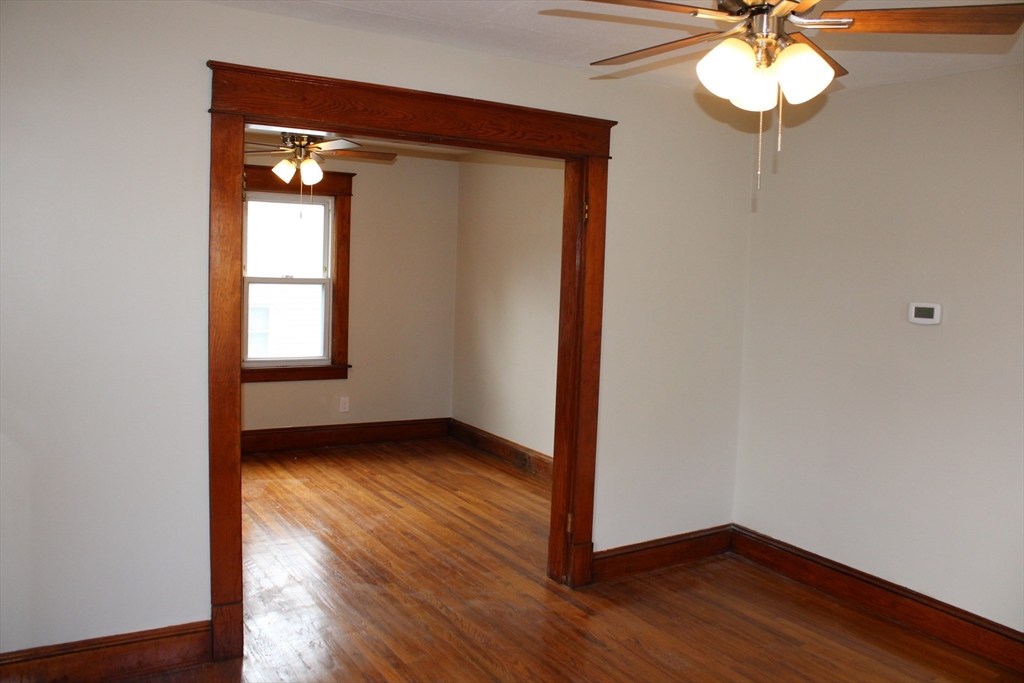 32 Kent Road Springfield, MA 01129 - Photo 12 of 30 a view of an empty room with wooden floor and a window