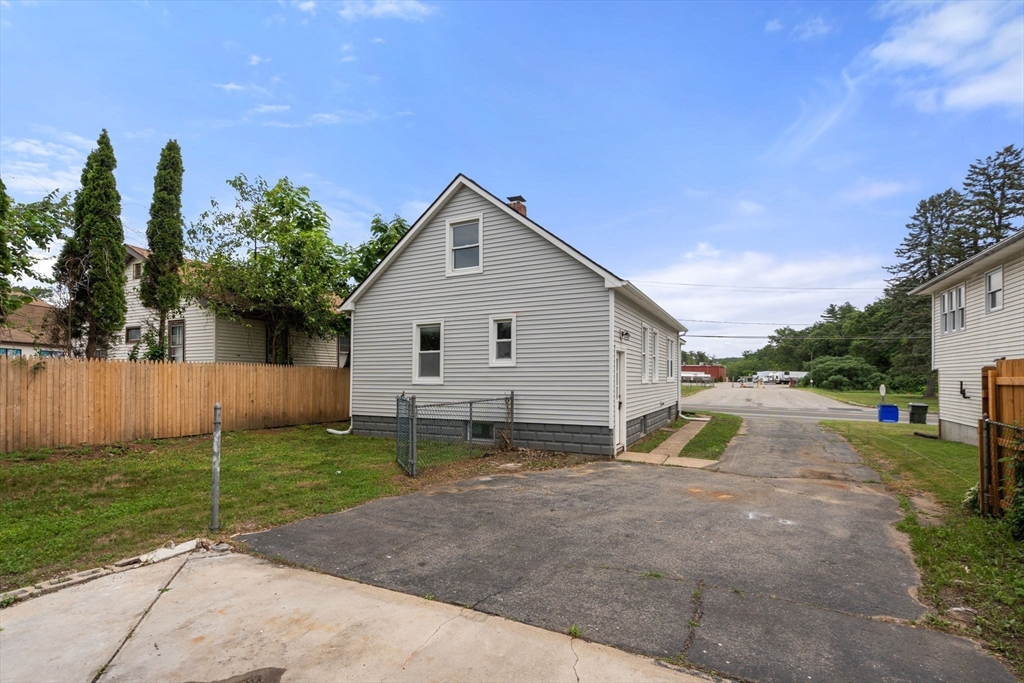 32 Kent Road Springfield, MA 01129 - Photo 27 of 30 a view of a house with backyard and a tree