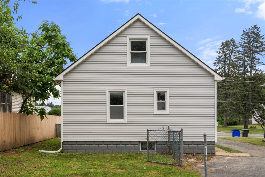 32 Kent Road Springfield, MA 01129 - Photo 28 of 30 a view of a house with a yard and lawn chairs
