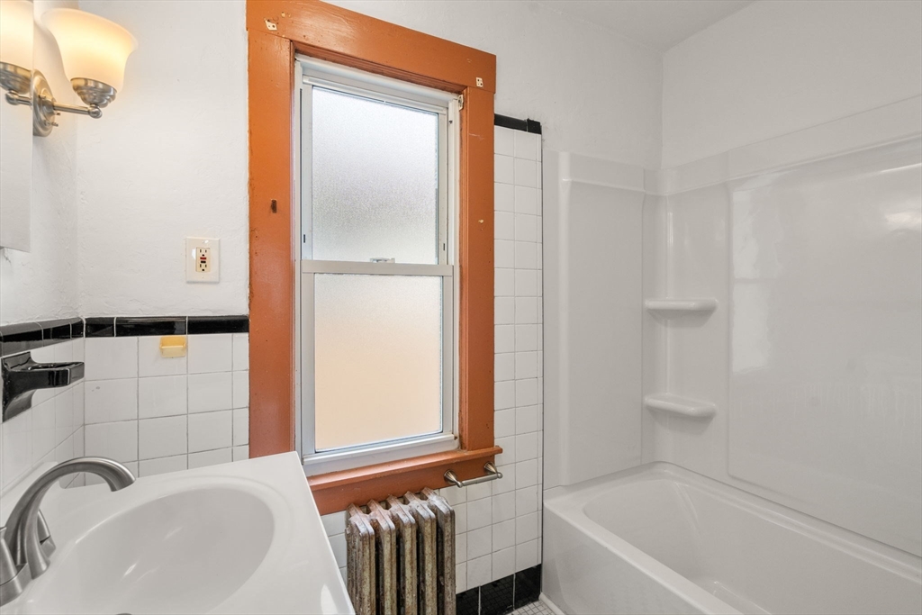 32 Kent Road Springfield, MA 01129 - Photo 7 of 30 a bathroom with a sink and a bathtub