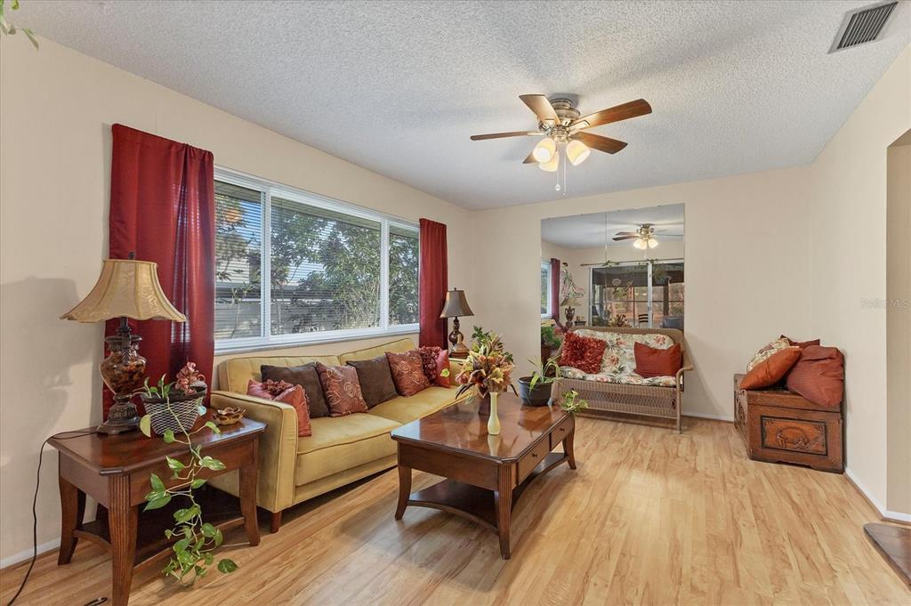 3947 Panola Lane, Unit 180 Sarasota, FL 34232 - Photo 18 of 49 a living room with furniture and a large window