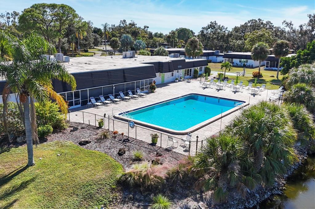 3947 Panola Lane, Unit 180 Sarasota, FL 34232 - Photo 39 of 49 a view of a swimming pool with a patio