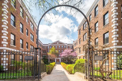 a view of building with a swimming pool