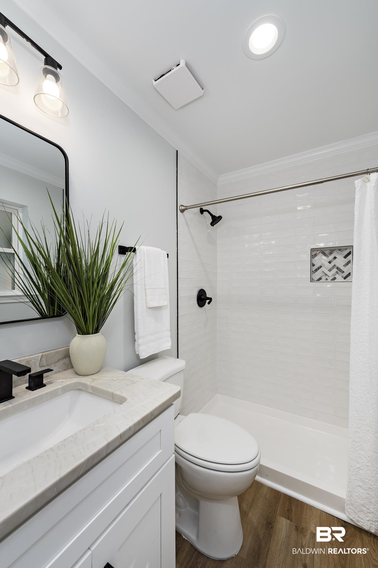 6001 Camp Halls Mill Road Mobile, AL 36619 - Photo 35 of 52 Full bathroom with dark wood-style flooring, vanity, crown molding, and tiled shower