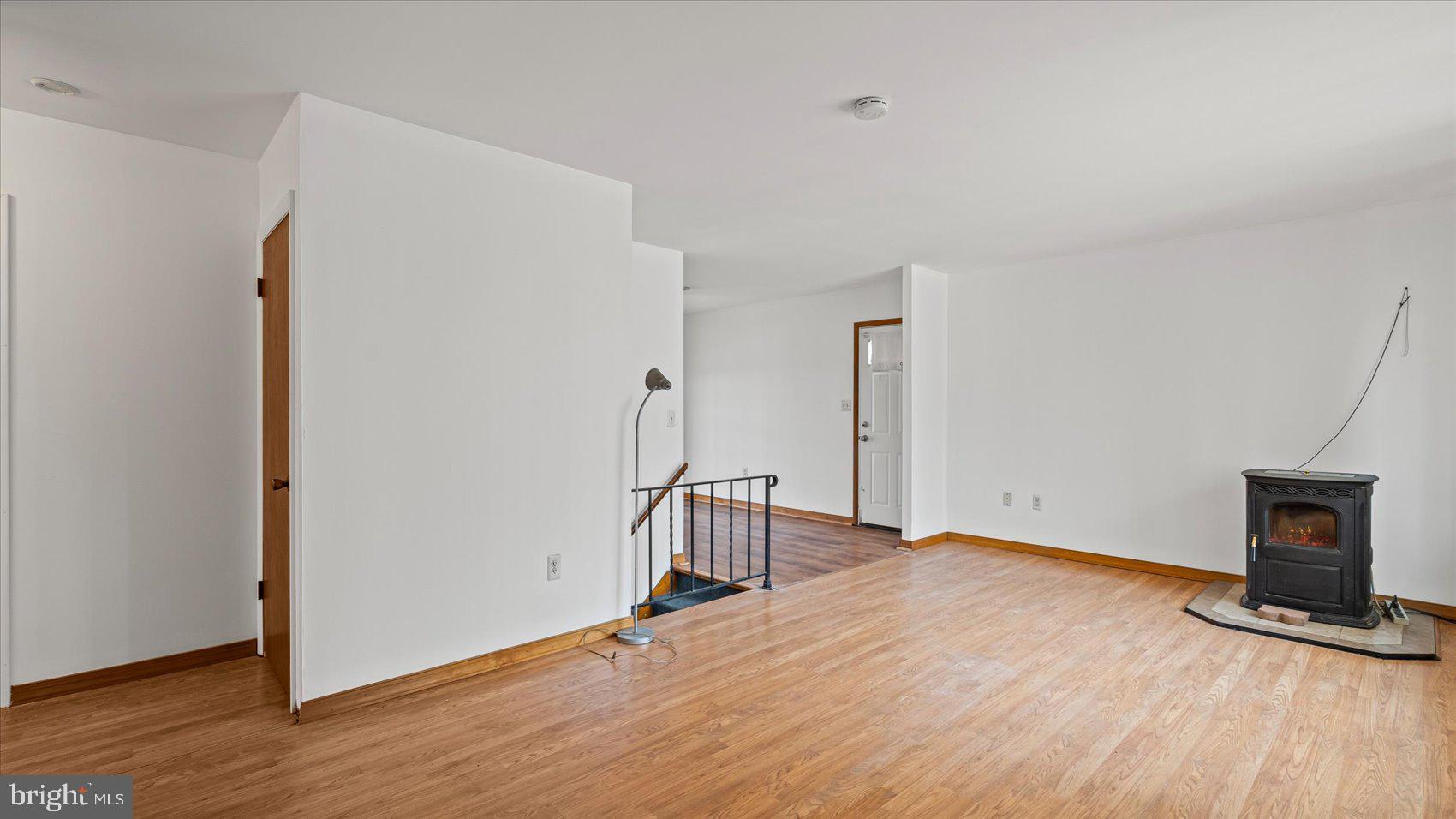 1802 Larch Drive Edgewood, MD 21040 - Photo 5 of 33 a view of an empty room with wooden floor and a window