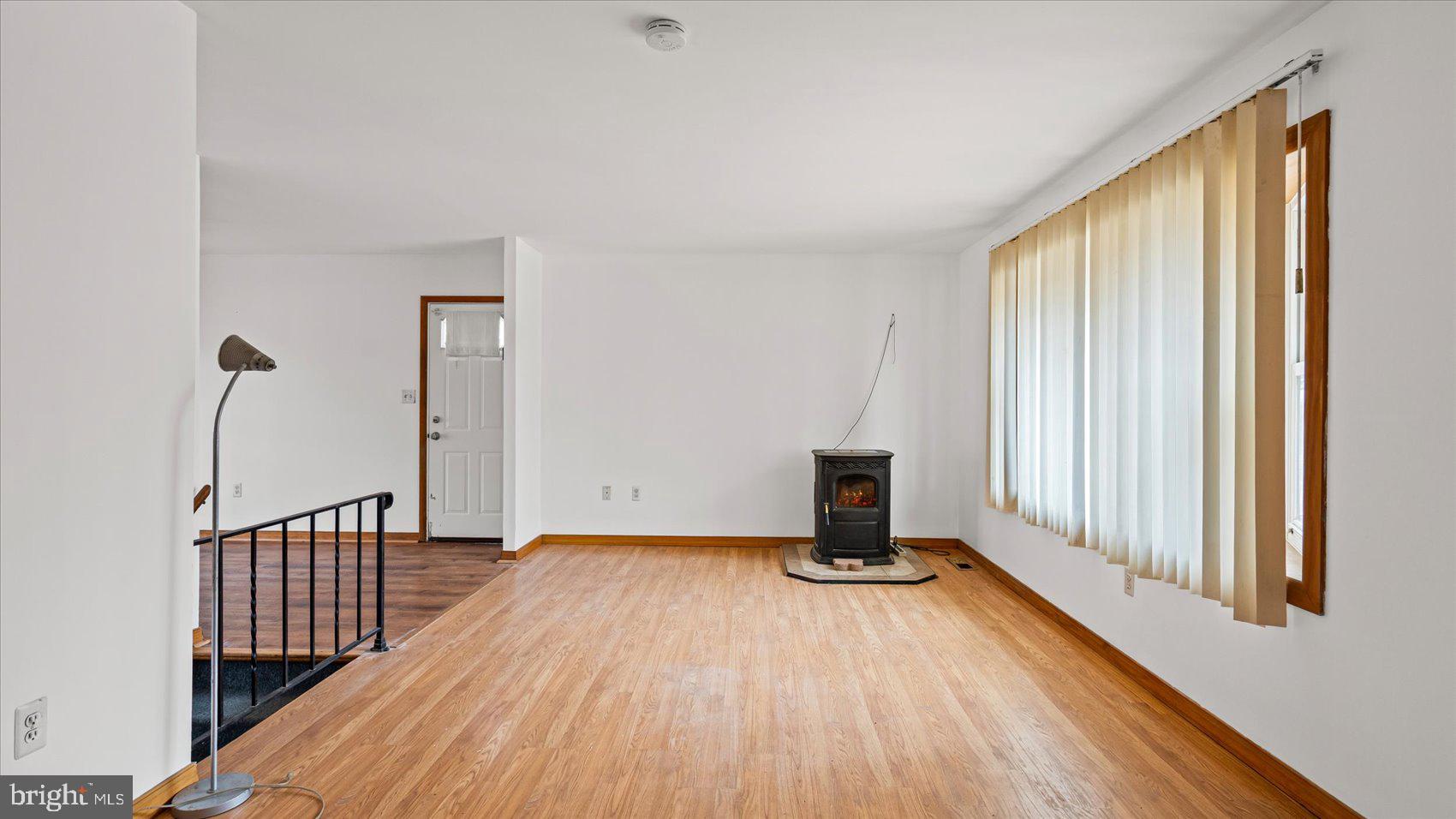 1802 Larch Drive Edgewood, MD 21040 - Photo 6 of 33 a view of a livingroom with wooden floor and stairs