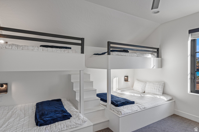 5367 Cyan Lane St. George, UT 84790 - Photo 12 of 49 Integrated bunk beds featuring built-in stair access, individual lighting fixtures, and a vaulted ceiling