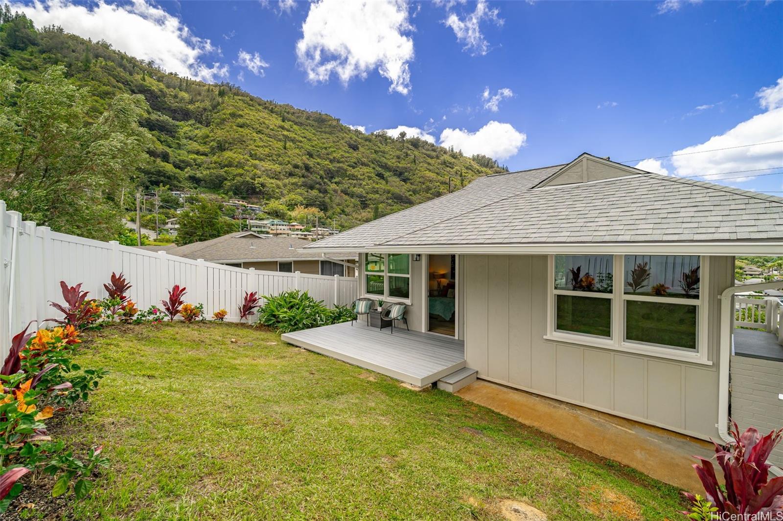 3036 Kahaloa Drive, Unit 2 Honolulu, HI 96822 - Photo 1 of 1 a front view of a house with yard