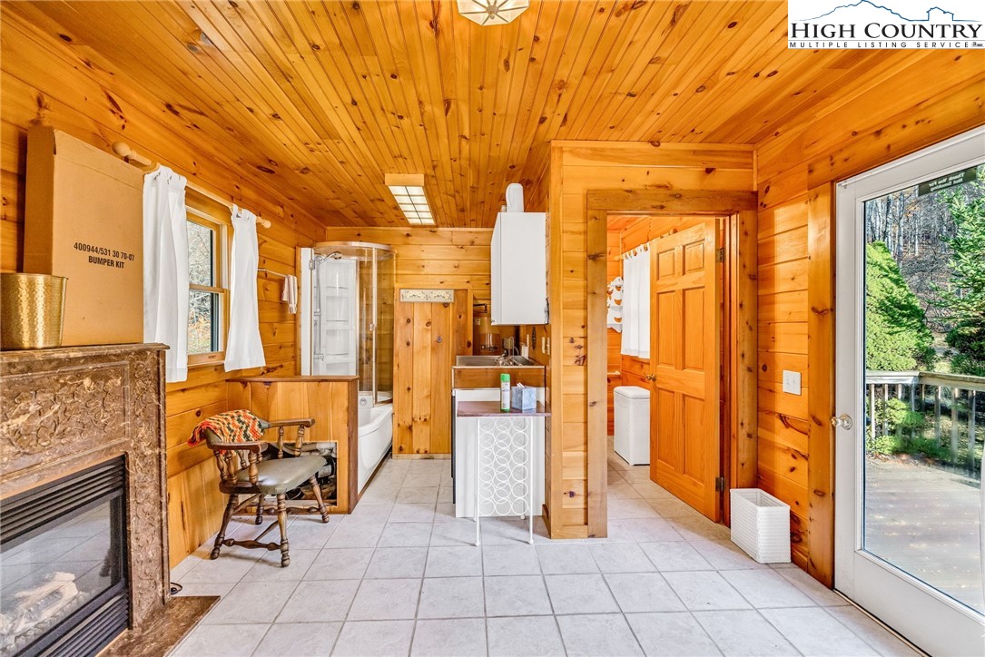1451 Elliott Road West Jefferson, NC 28694 - Photo 15 of 33 a view of an entryway with furniture and floor to ceiling window