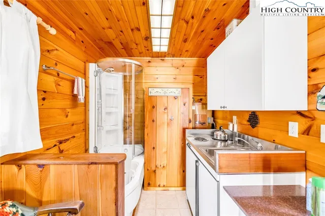 a dining room with furniture and a window