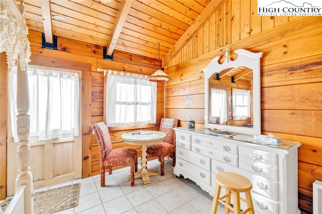 1451 Elliott Road West Jefferson, NC 28694 - Photo 20 of 33 a dining room with furniture and a window