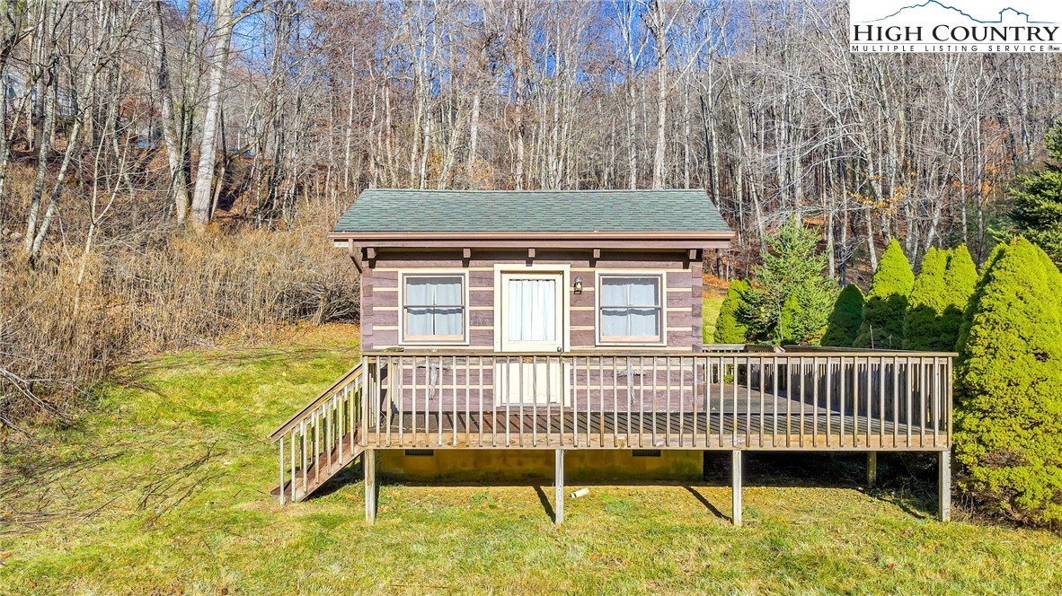 1451 Elliott Road West Jefferson, NC 28694 - Photo 2 of 33 a view of a chair and table on the wooden floor