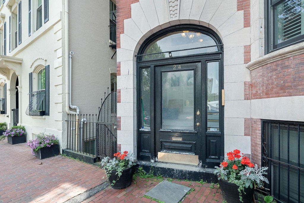 24 Montgomery Street, Unit 1 Boston, MA 02116 - Photo 14 of 15 a front view of a house with a garden
