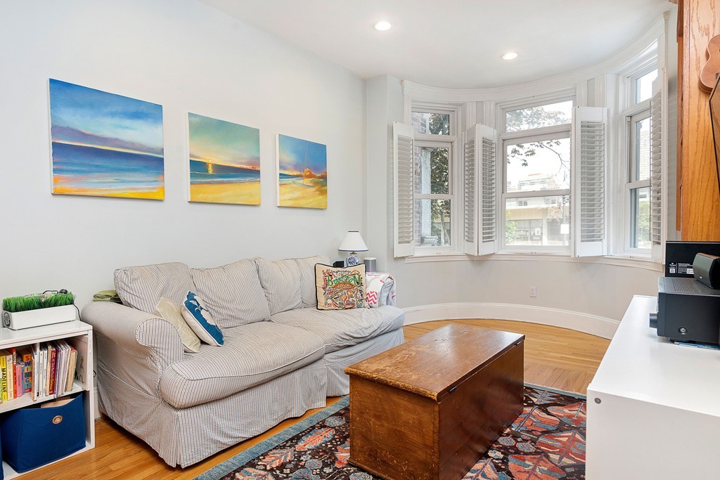 24 Montgomery Street, Unit 1 Boston, MA 02116 - Photo 5 of 15 a living room with furniture and a window