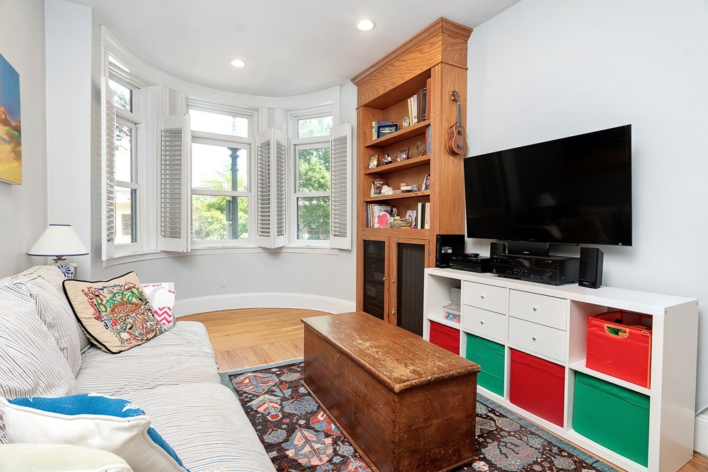 24 Montgomery Street, Unit 1 Boston, MA 02116 - Photo 6 of 15 a living room with furniture and a flat screen tv
