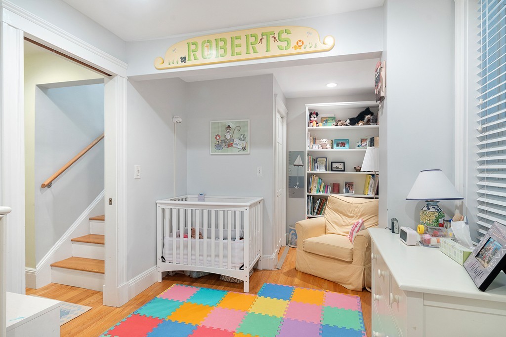 24 Montgomery Street, Unit 1 Boston, MA 02116 - Photo 10 of 15 a bedroom with furniture and a rug