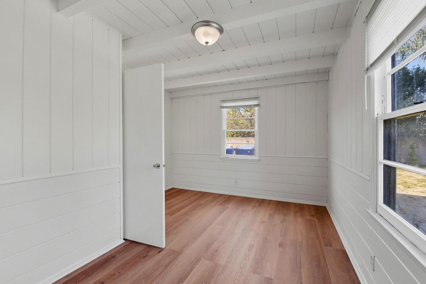 18601 Keswick Street, Unit B Reseda, CA 91335 - Photo 7 of 16 a view of a room with wooden floor and a window