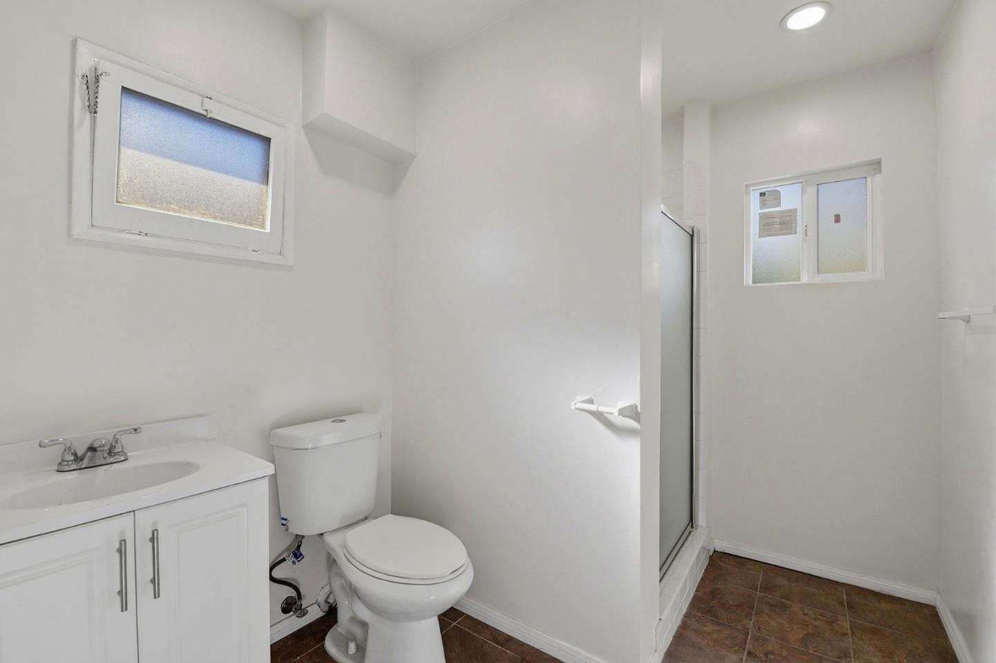 18601 Keswick Street, Unit B Reseda, CA 91335 - Photo 9 of 16 a bathroom with a toilet sink and vanity