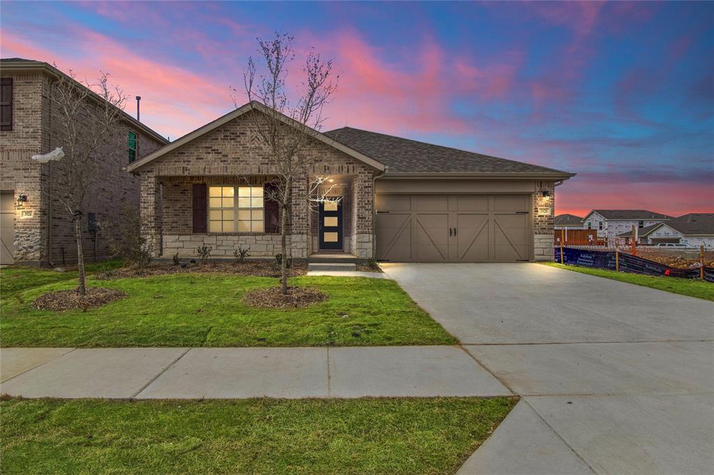 3928 White Rock Road Celina, TX 75009 - Photo 1 of 1 a front view of a house with a yard and garage