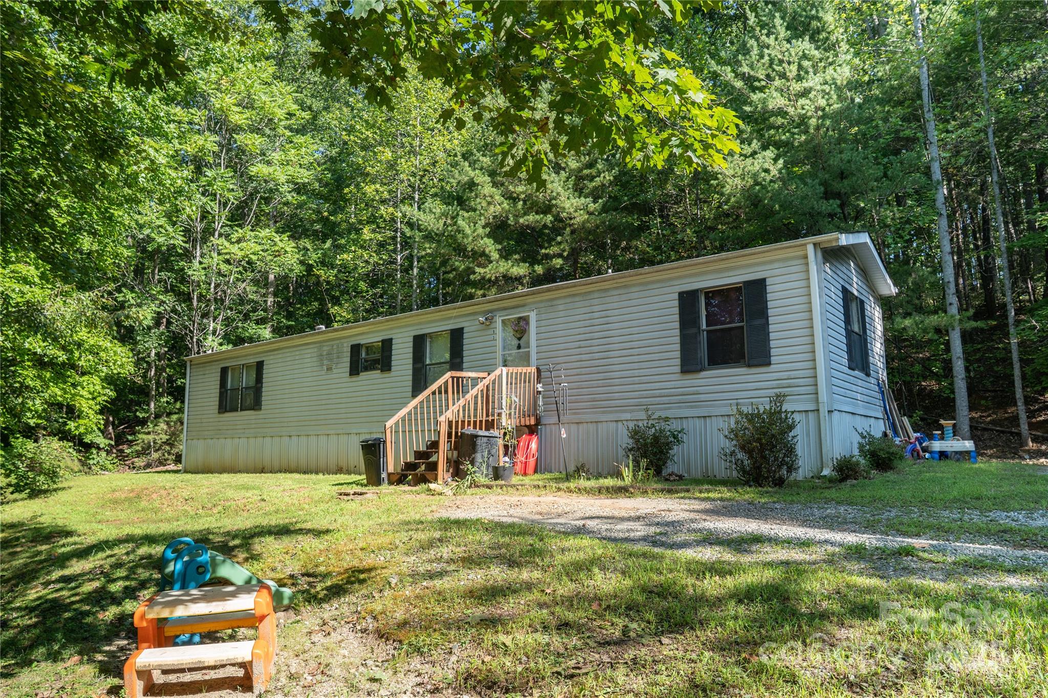 1 Elijah Circle Columbus, NC 28722 - Photo 8 of 23 a view of a house with backyard and sitting area