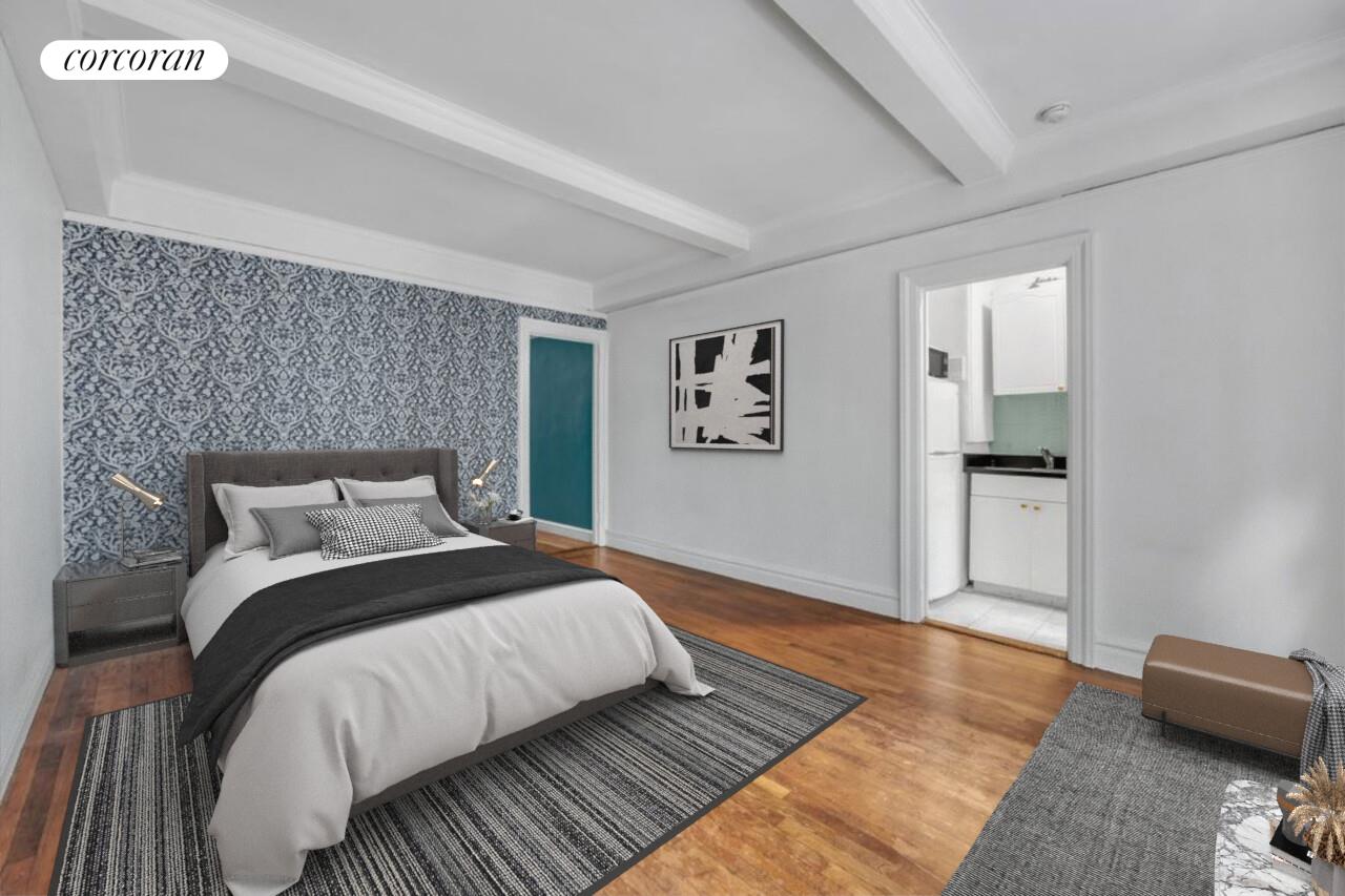 17 West 64th Street, Unit 2E Manhattan, NY 10023 - Photo 2 of 5 a bedroom with bed and night stand