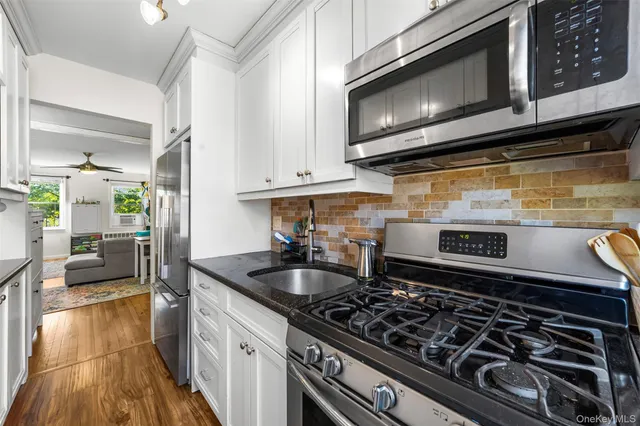 a kitchen with a stove and a microwave